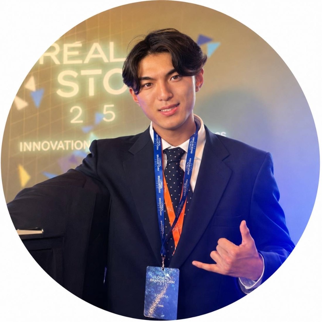 Shoki Sakuma in a suit at L'Oréal Brandstorm 2025